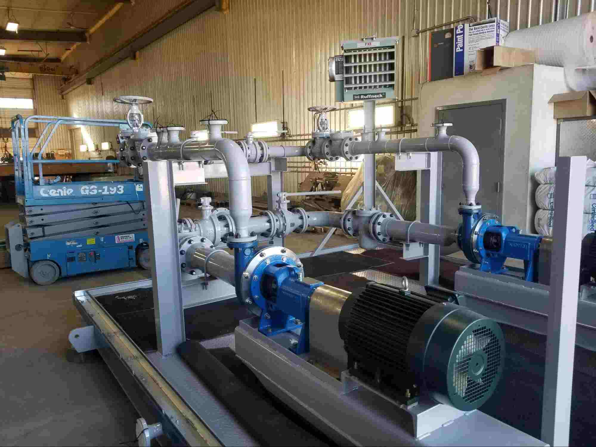 Industrial centrifugal pump system with electric motor, valves, and piping mounted on a skid, illustrating how does a centrifugal pump work in an industrial fluid transfer setup.